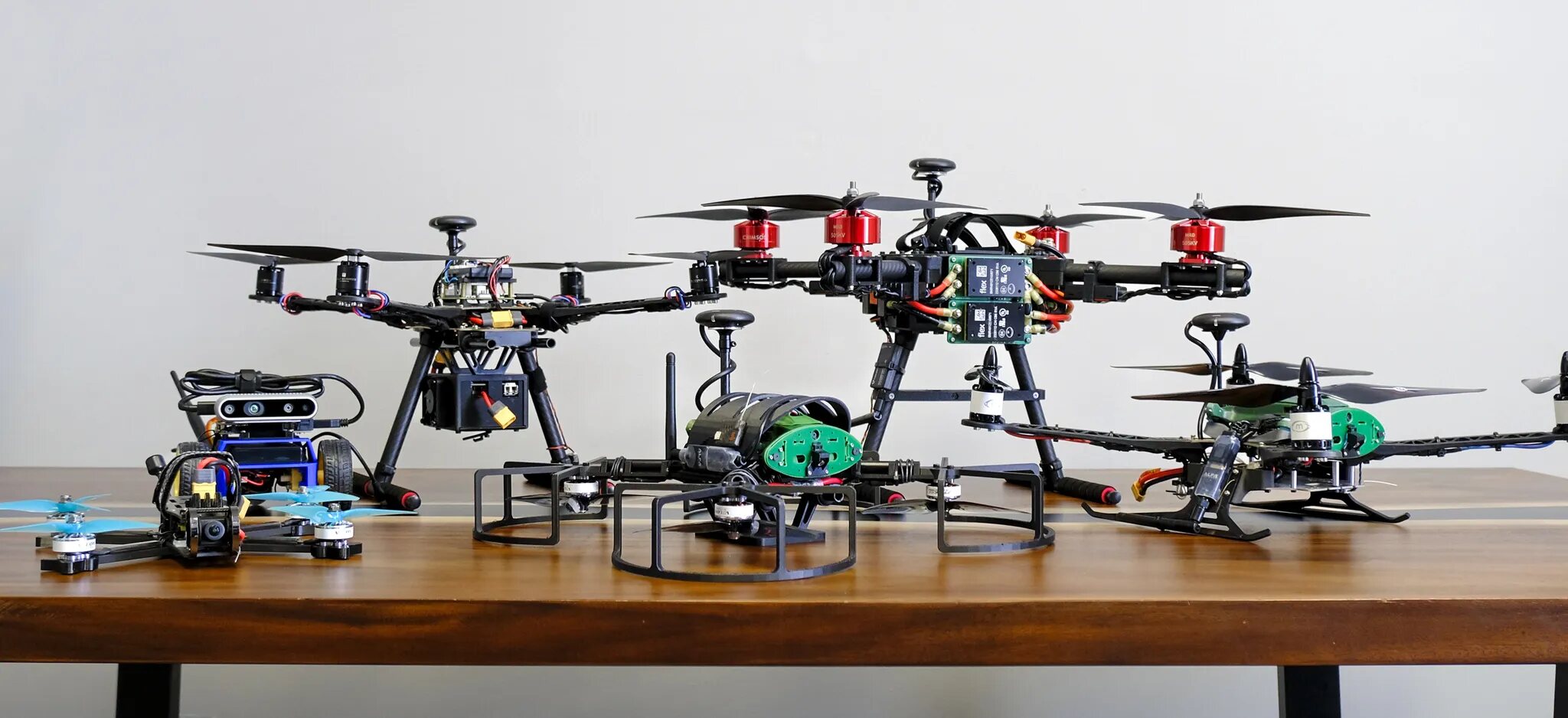A lineup of unmanned aerial systems developed in the LlamaWorks prototyping lab